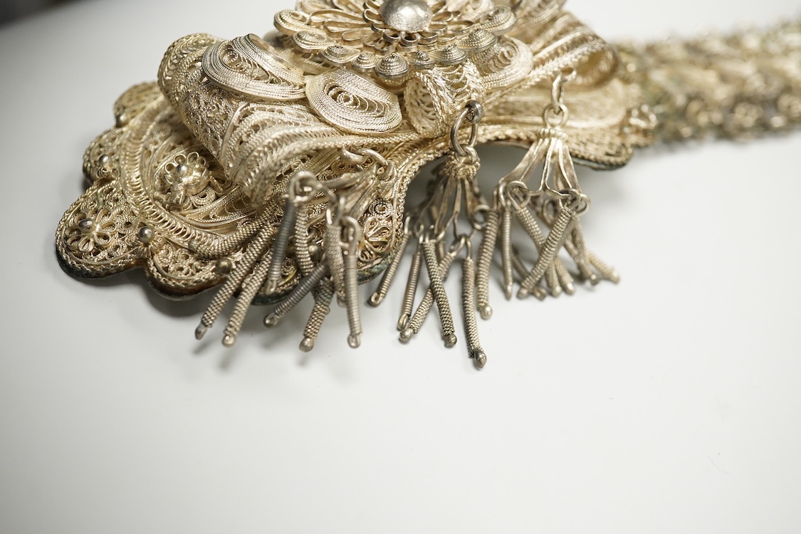 An Indian white metal filigree belt, 86cm.